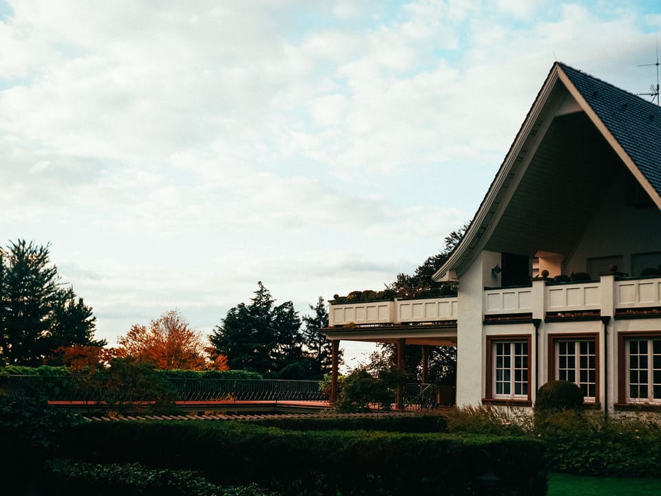 A single-family home surrounded by trees, typical of the properties we work on.